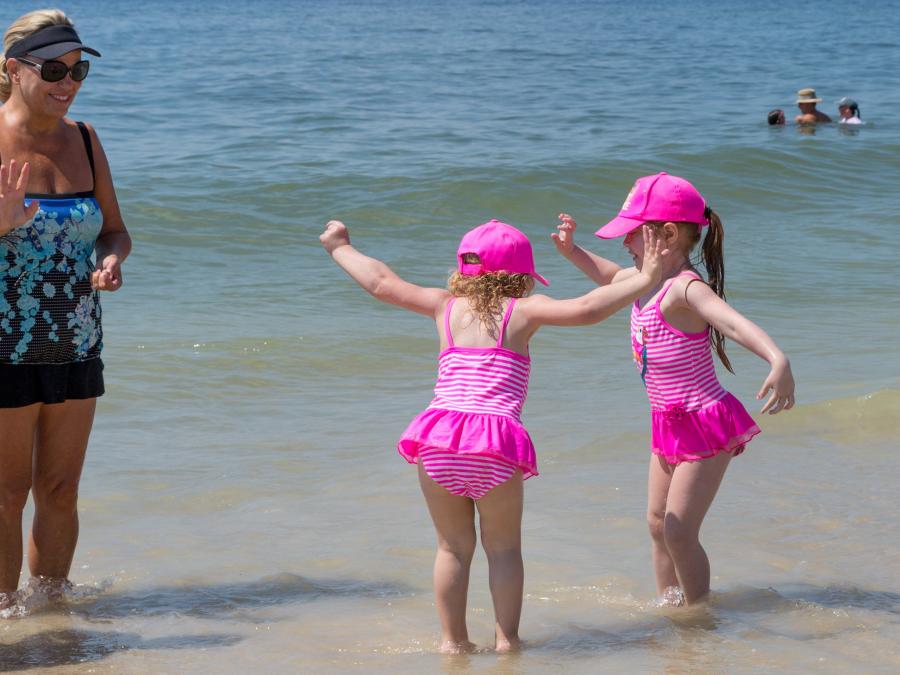 little girls playing on the beach